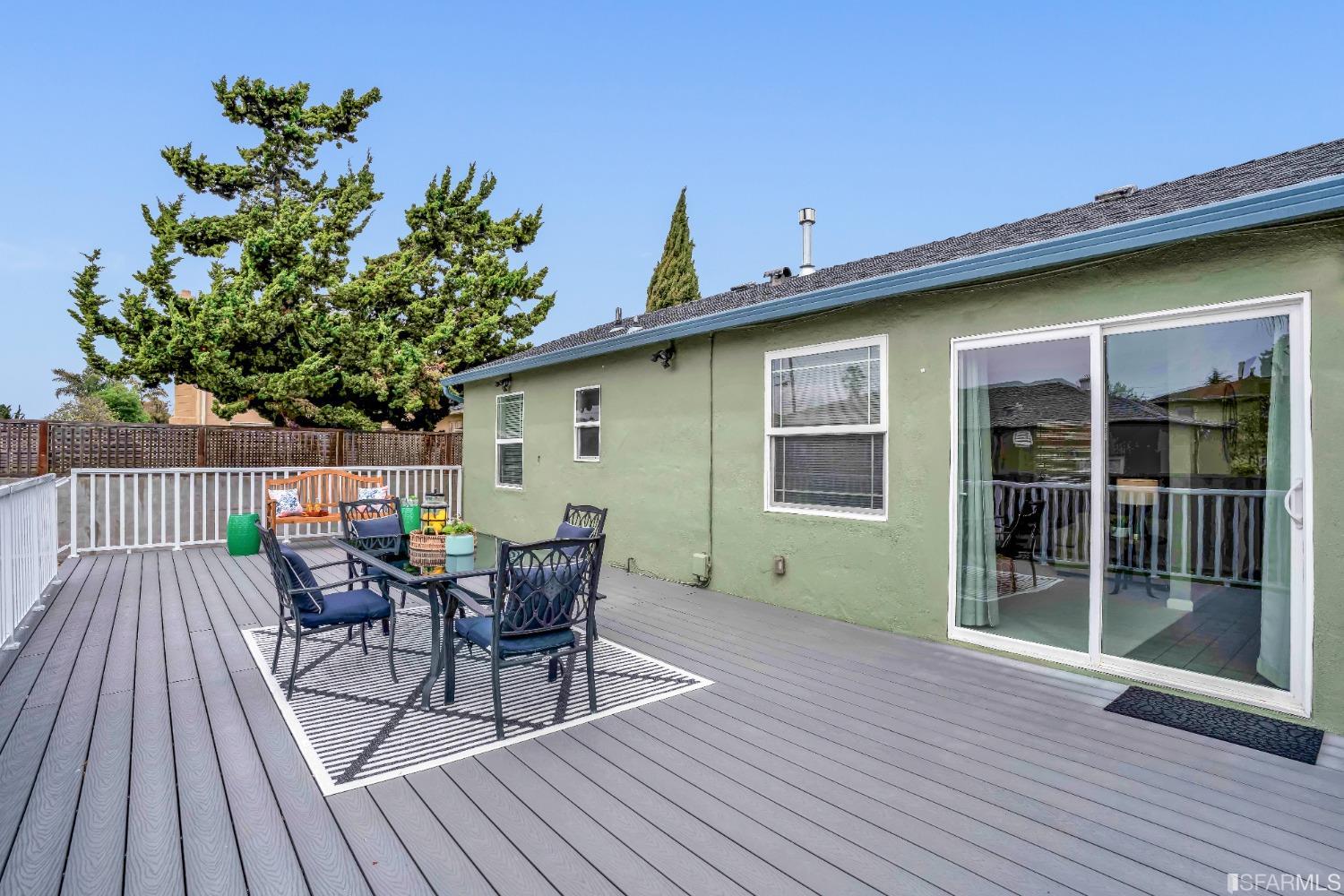 476 Violet Street San Leandro, CA 94578 - Photo 25 of 30 a view of a deck with table and chairs and wooden floor