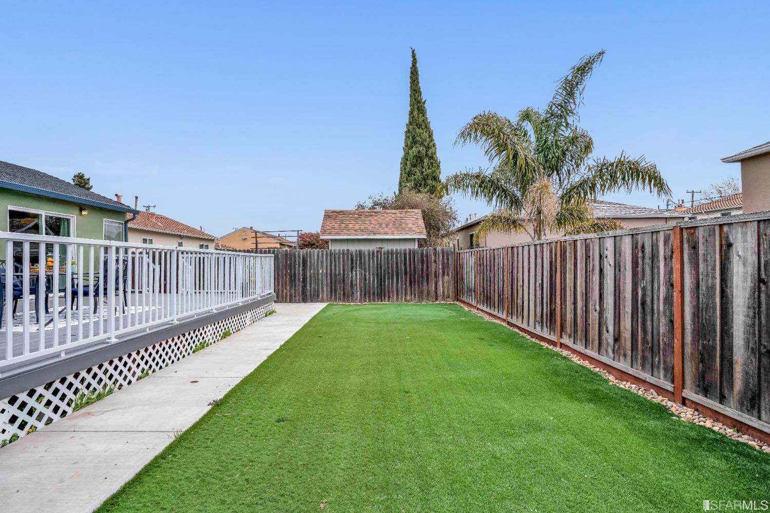 476 Violet Street San Leandro, CA 94578 - Photo 27 of 30 a view of a garden with wooden fence