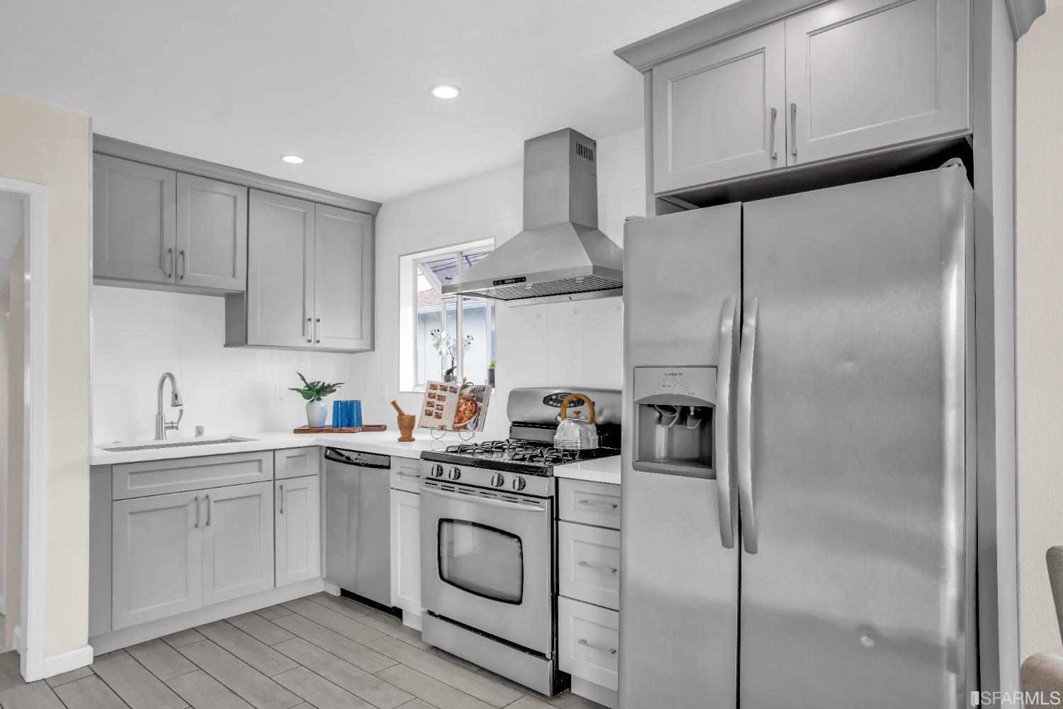476 Violet Street San Leandro, CA 94578 - Photo 8 of 30 a kitchen with a sink stainless steel appliances and cabinets