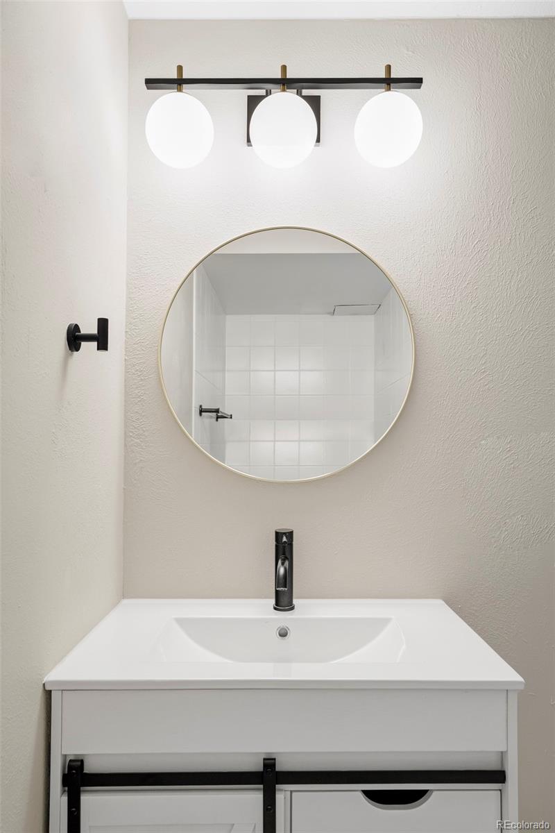 4345 Eagle Street Denver, CO 80239 - Photo 16 of 20 a bathroom with a sink