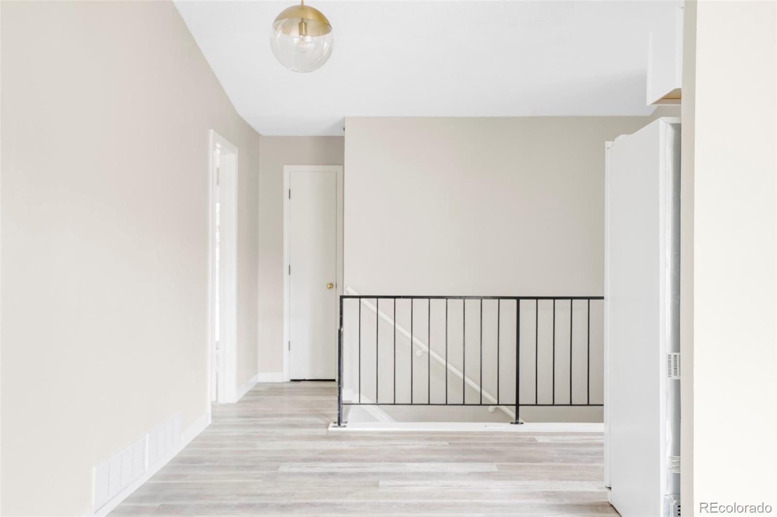 4345 Eagle Street Denver, CO 80239 - Photo 8 of 20 a view of a room with wooden floor
