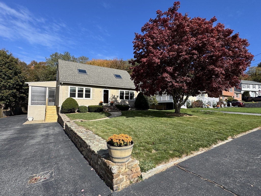 a front view of a house with garden