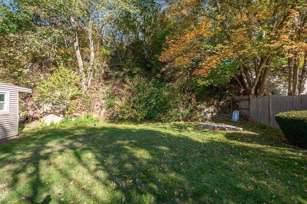 28 Macomber Road Gloucester, MA 01930 - Photo 11 of 40 a backyard of a house with table and chairs