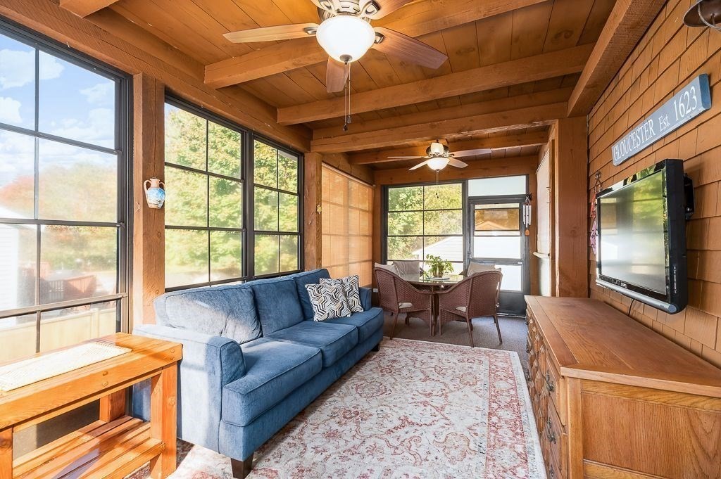 28 Macomber Road Gloucester, MA 01930 - Photo 14 of 40 a living room with furniture and a flat screen tv