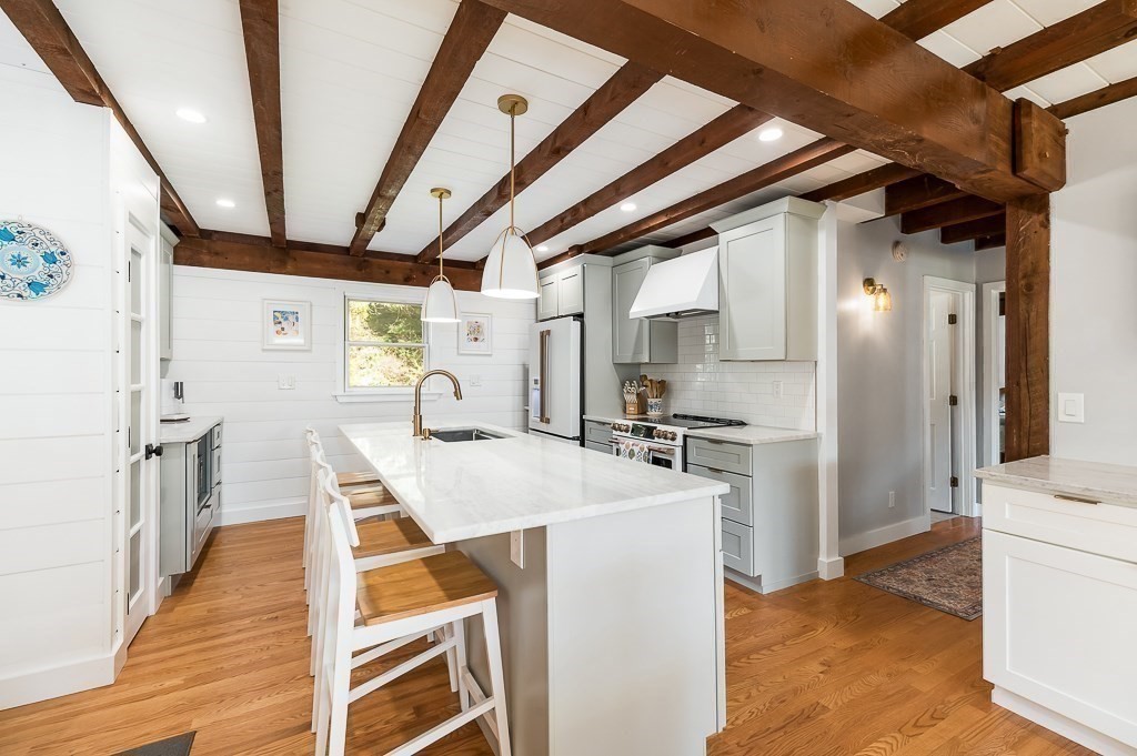 28 Macomber Road Gloucester, MA 01930 - Photo 16 of 40 a kitchen with refrigerator and cabinets