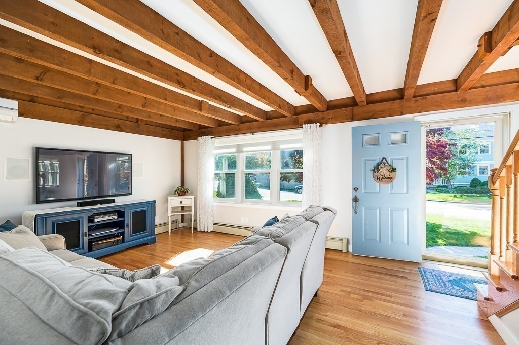 28 Macomber Road Gloucester, MA 01930 - Photo 24 of 40 a living room with furniture flat screen tv and a large window