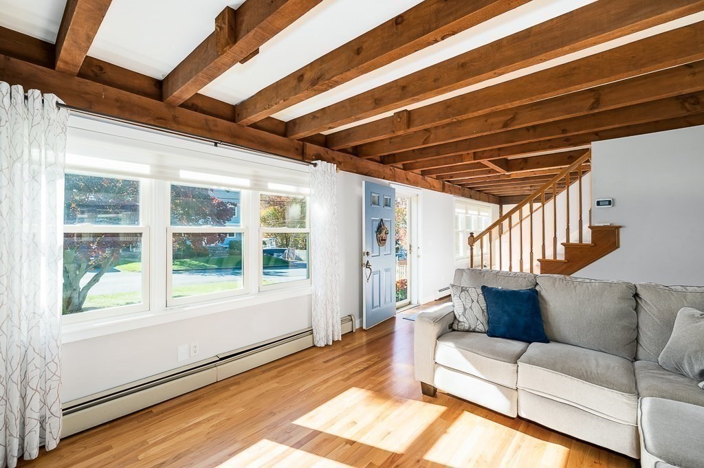 28 Macomber Road Gloucester, MA 01930 - Photo 25 of 40 a living room with furniture and a large window