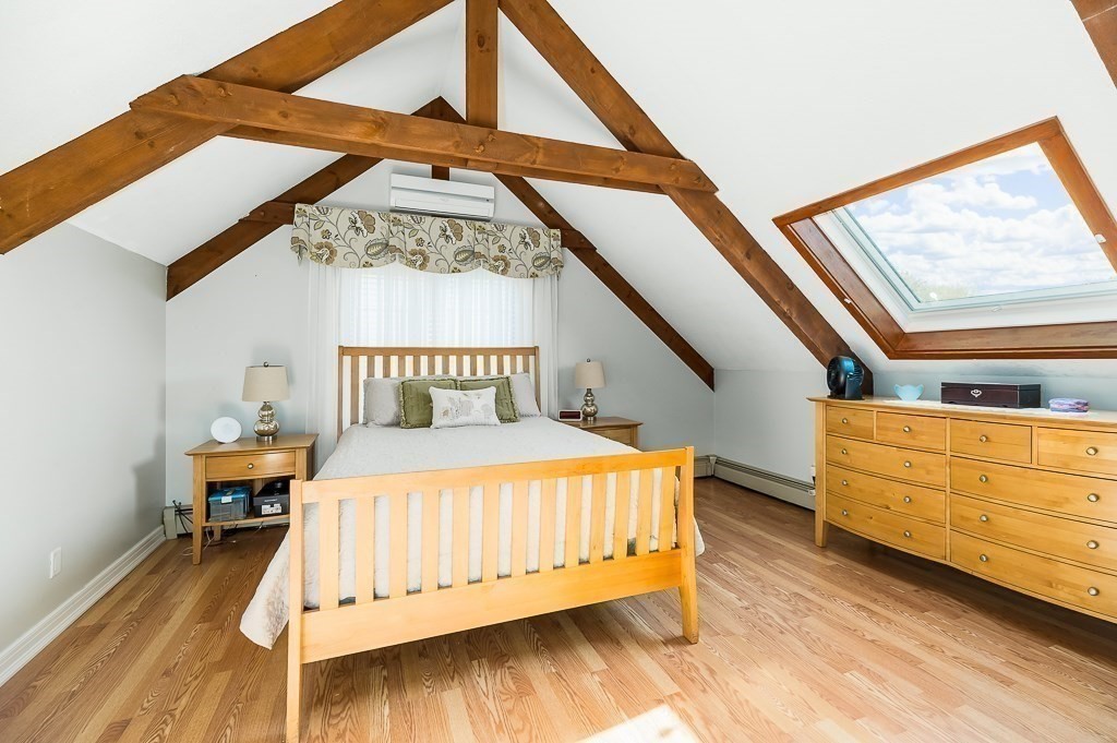 28 Macomber Road Gloucester, MA 01930 - Photo 29 of 40 a bedroom with a bed and a window