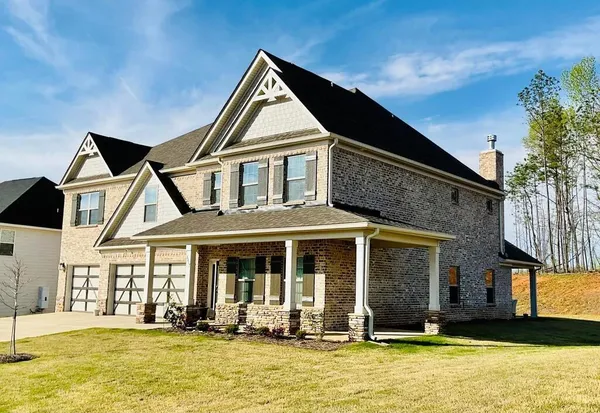 a front view of a house with a yard