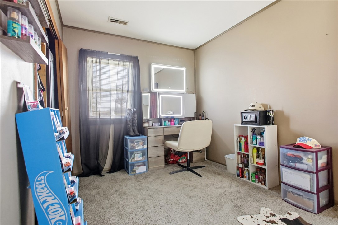 2745 Share Street Springfield, OH 45505 - Photo 21 of 28 This cozy bedroom features soft carpeting, perfect for quiet enjoyment and restful nights.