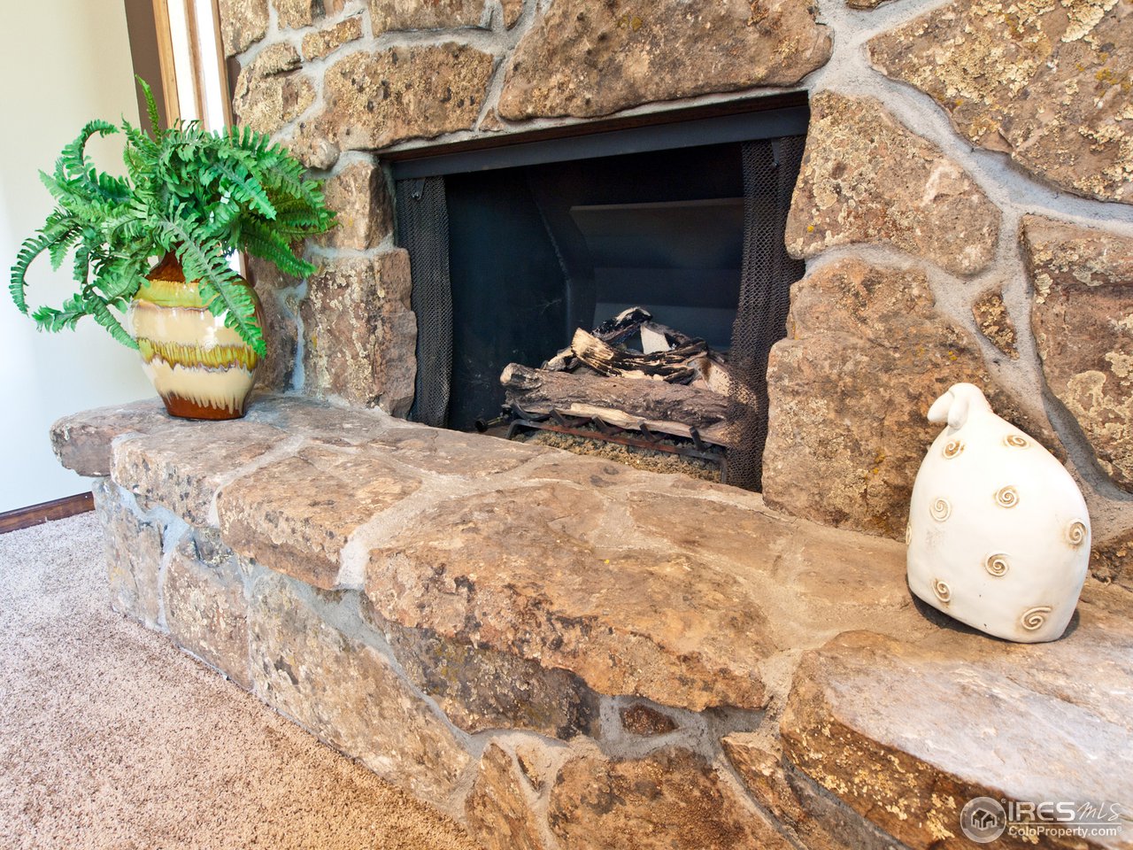 534 Del Clair Road Fort Collins, CO 80525 - Photo 10 of 25 Stone fireplace