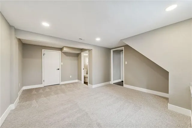 a large house with a large tree in front of it