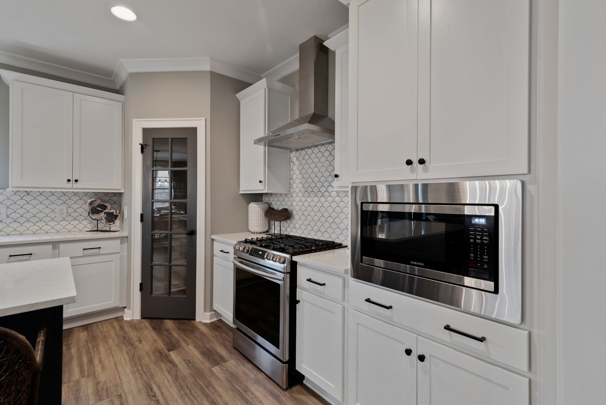 841 Plowson Road Mount Juliet, TN 37122 - Photo 11 of 40 a kitchen with stainless steel appliances a stove a sink and cabinets