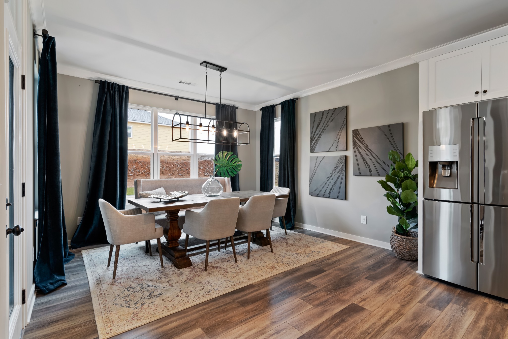 841 Plowson Road Mount Juliet, TN 37122 - Photo 12 of 40 a dining room with furniture a window and wooden floor