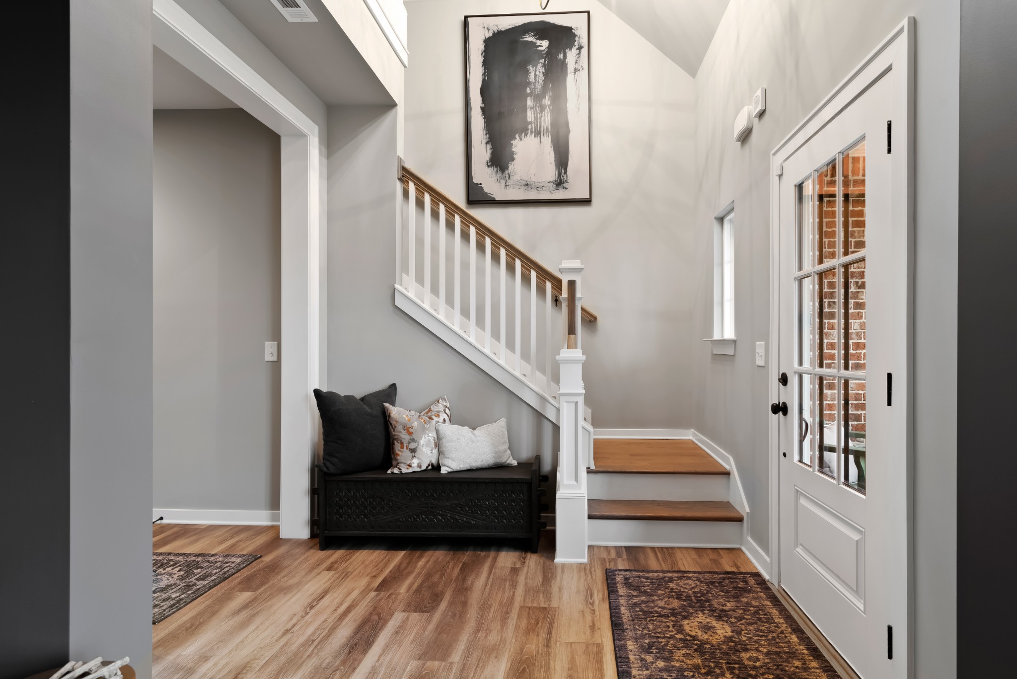 841 Plowson Road Mount Juliet, TN 37122 - Photo 19 of 40 a view of a hallway with wooden floor and stairs