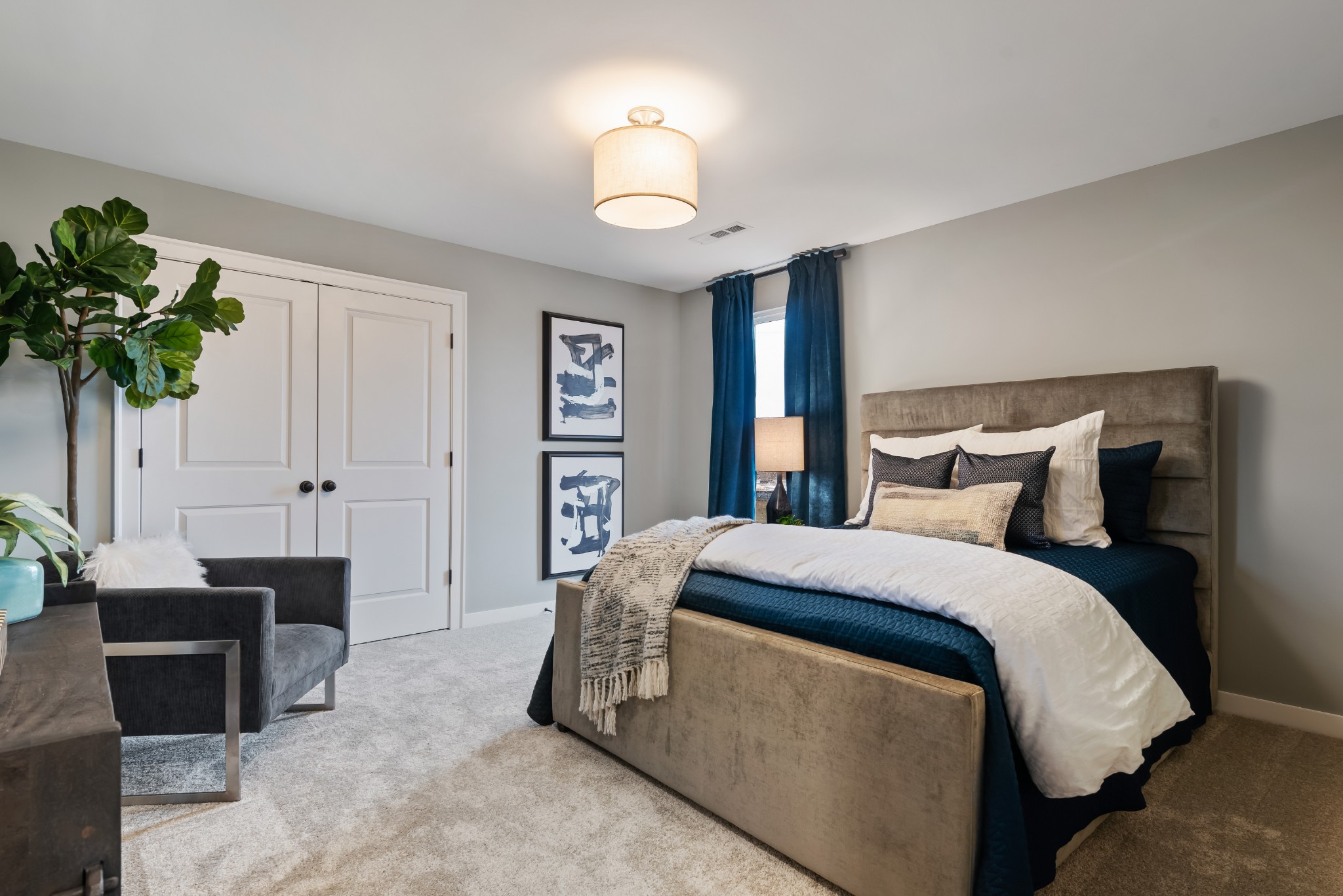 841 Plowson Road Mount Juliet, TN 37122 - Photo 27 of 40 a spacious bedroom with a bed and a chandelier