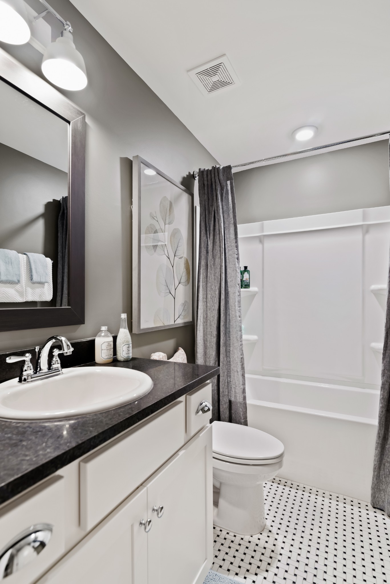 841 Plowson Road Mount Juliet, TN 37122 - Photo 32 of 40 a bathroom with a granite countertop sink toilet a shower a mirror and a bathtub