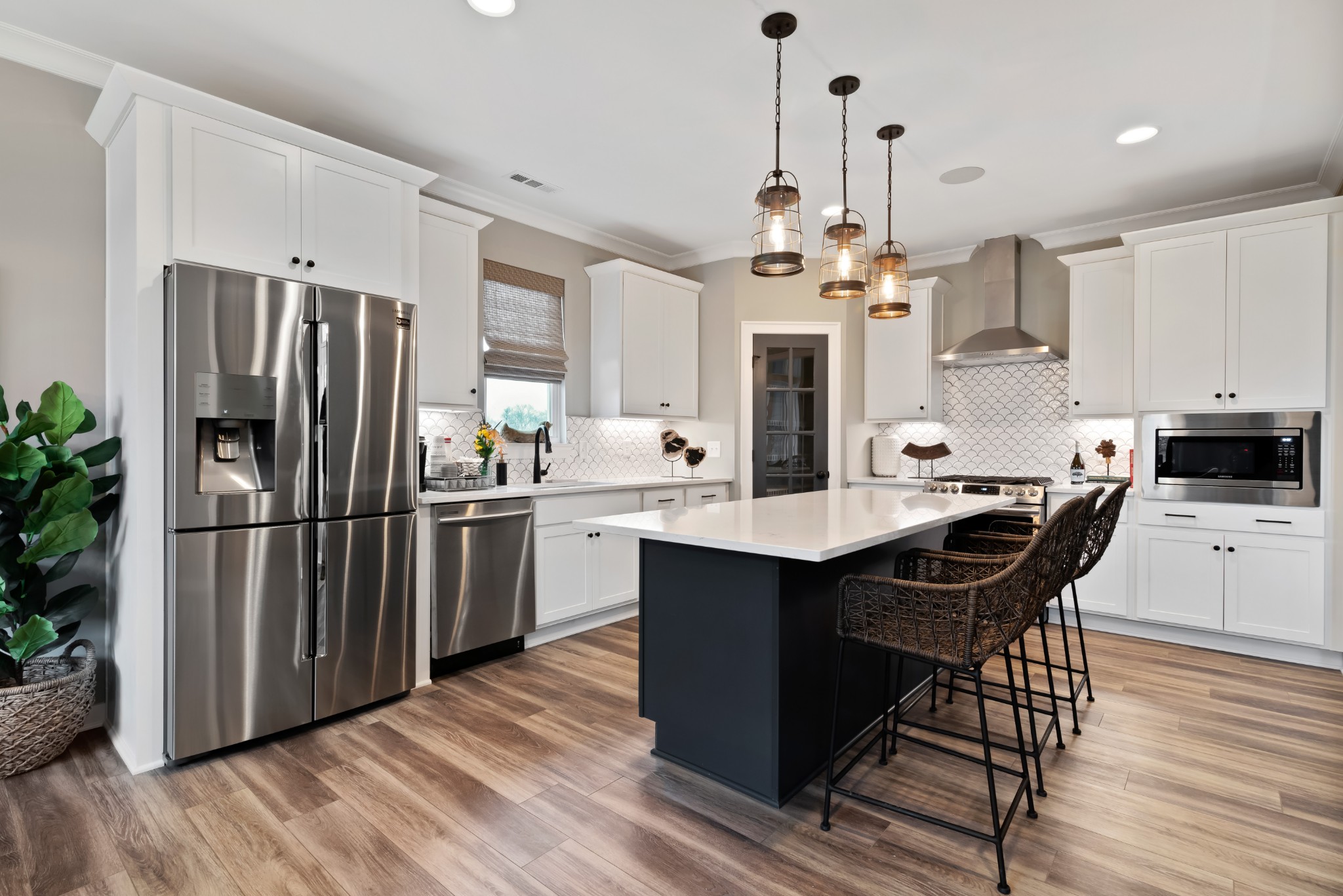 841 Plowson Road Mount Juliet, TN 37122 - Photo 8 of 40 a kitchen with stainless steel appliances a dining table chairs stove and refrigerator