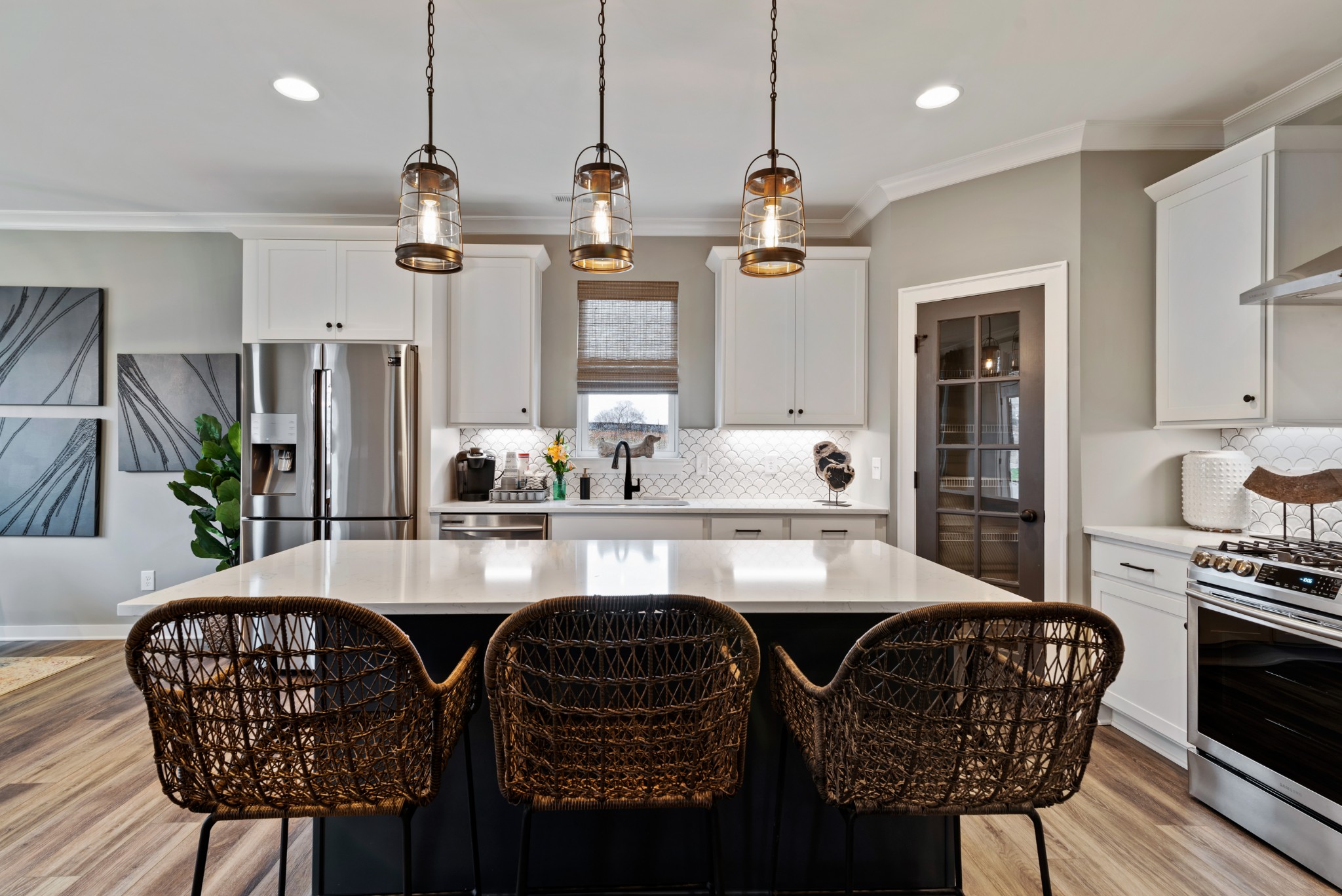 841 Plowson Road Mount Juliet, TN 37122 - Photo 9 of 40 a kitchen with stainless steel appliances granite countertop a kitchen island a table and chairs in it