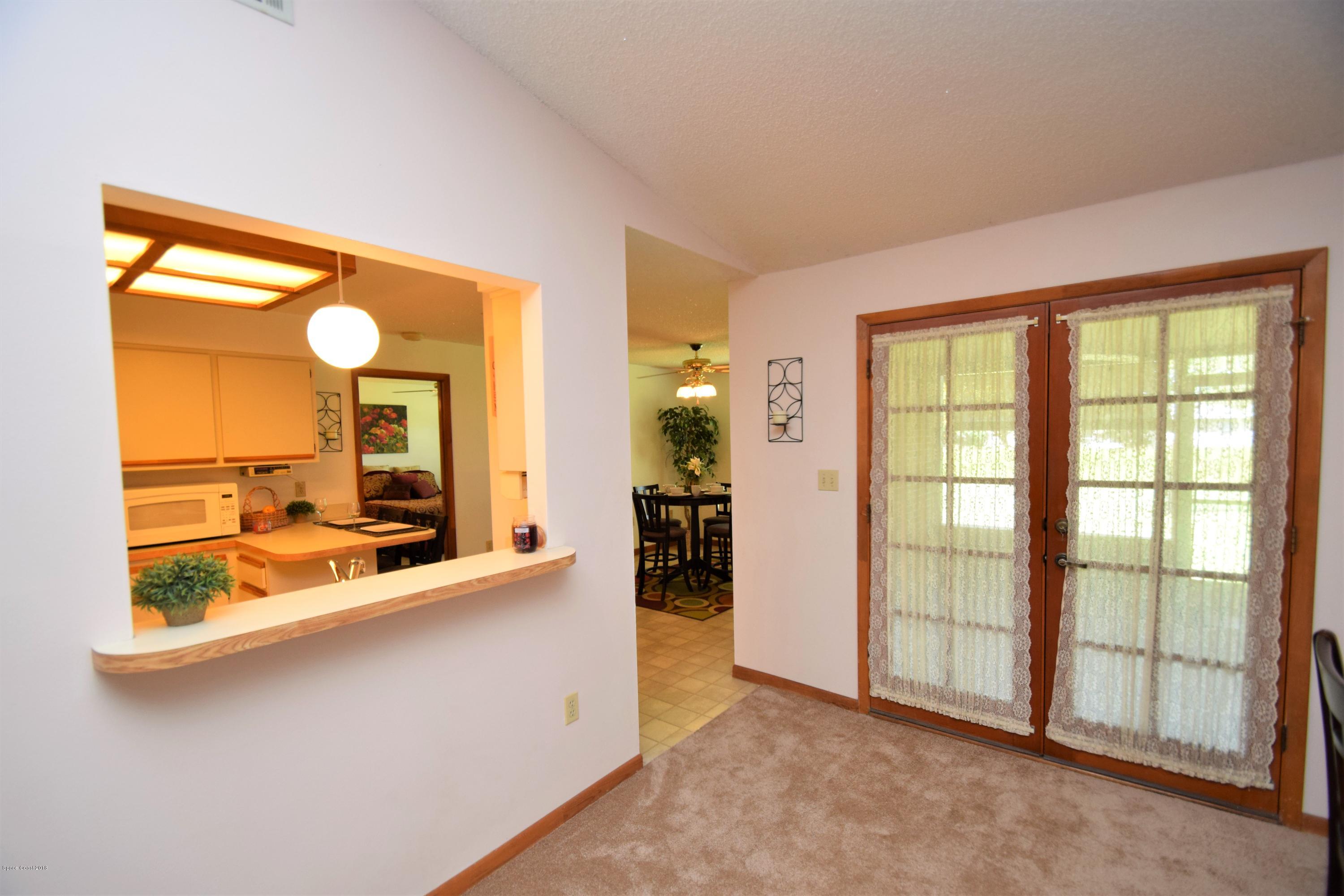 263 Sauders Road Southeast Palm Bay, FL 32909 - Photo 18 of 60 Pass through to dining