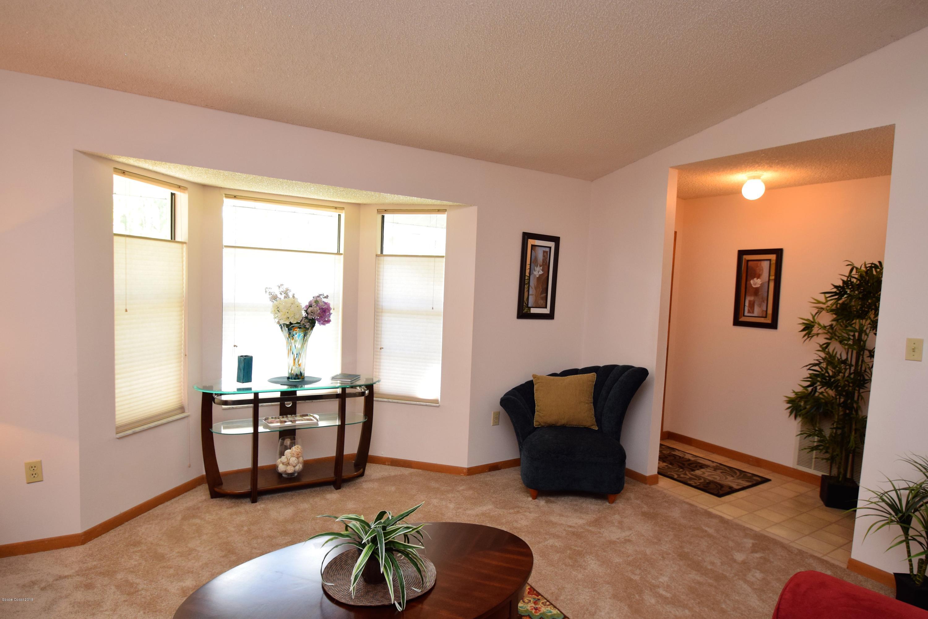 263 Sauders Road Southeast Palm Bay, FL 32909 - Photo 7 of 60 Foyer to Family room