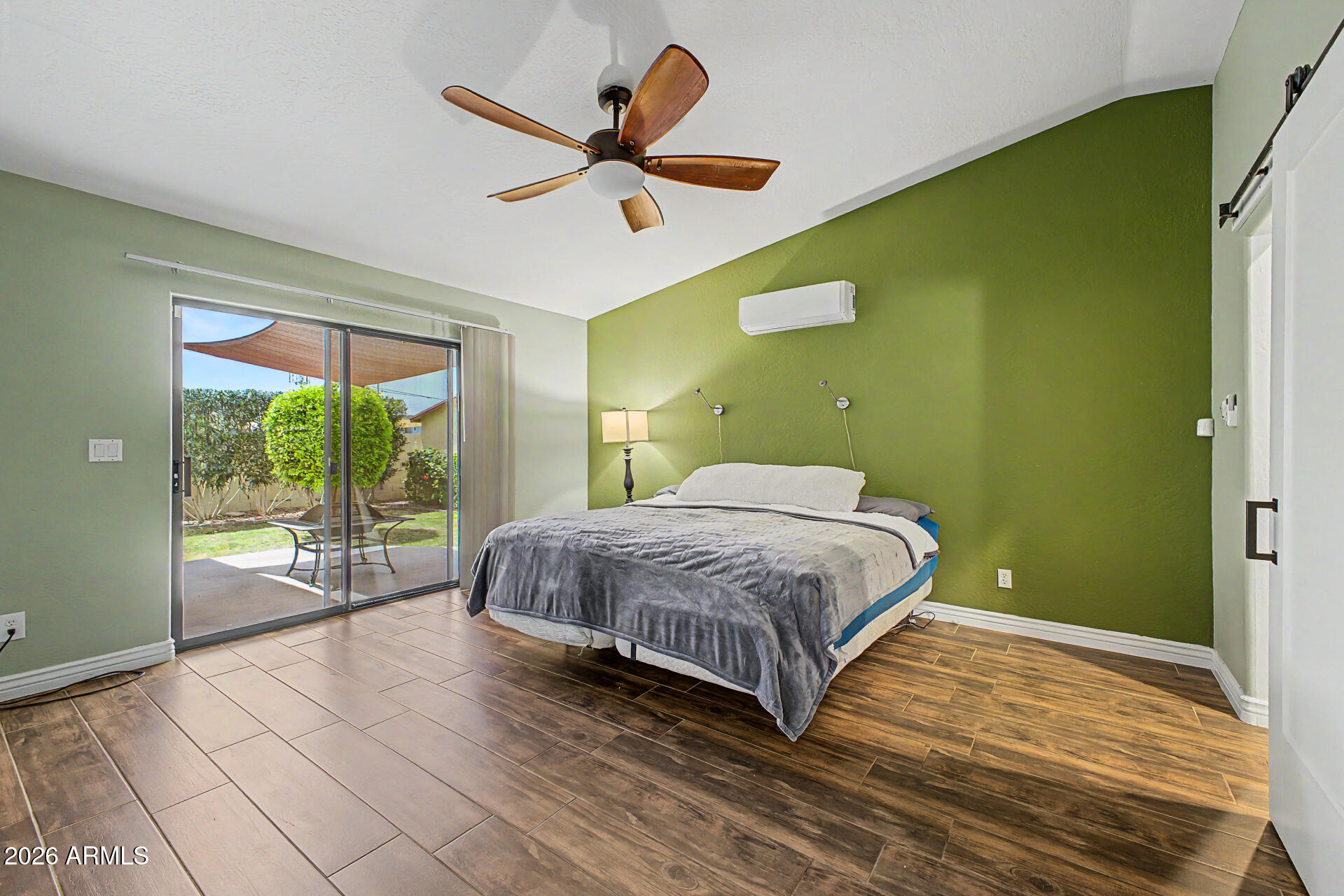 802 East Roberts Road Phoenix, AZ 85022 - Photo 10 of 24 a bedroom with a bed and a large window