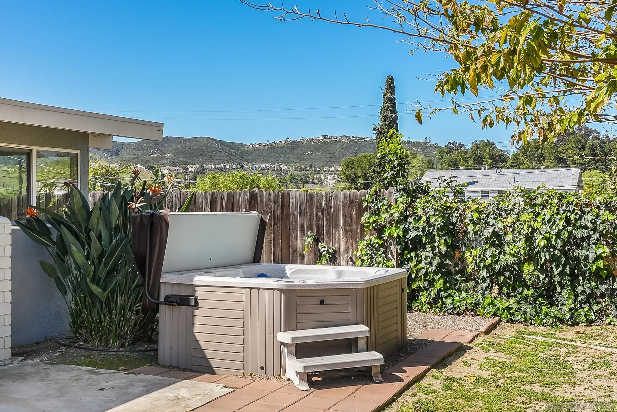 12510 Taunt Road Poway, CA 92064 - Photo 27 of 32 a view of a patio with a table and chairs