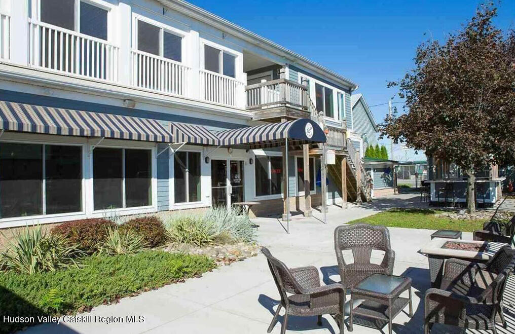 7 Main Street Catskill, NY 12414 - Photo 22 of 29 a view of a house with a dining table and chairs