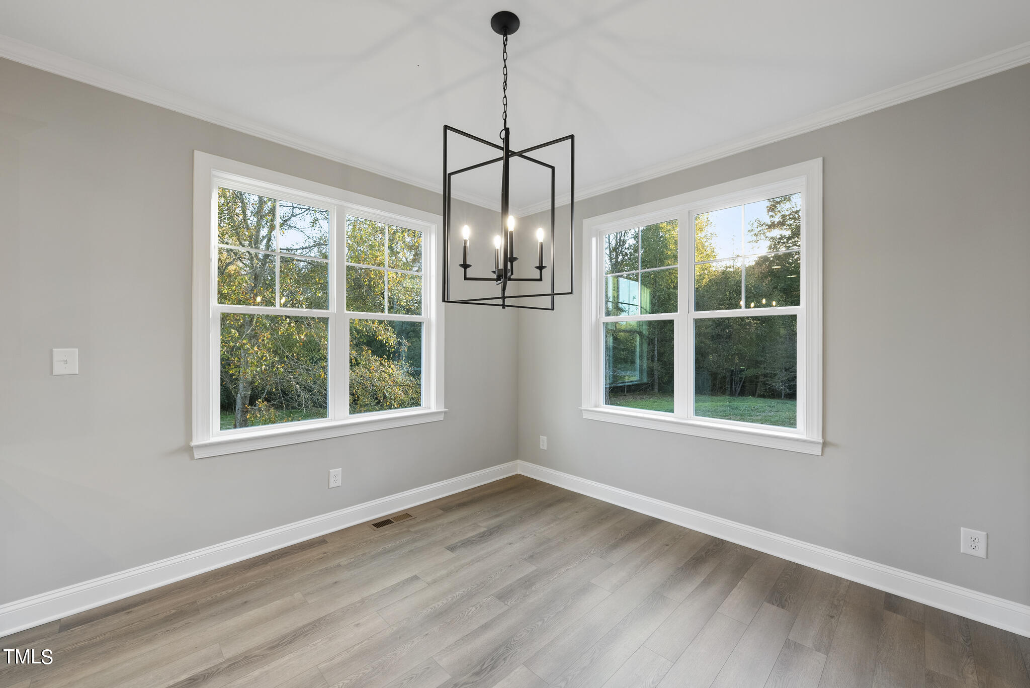 70 Pilot Ridge Road Zebulon, NC 27597 - Photo 13 of 37 an empty room with wooden floor and windows