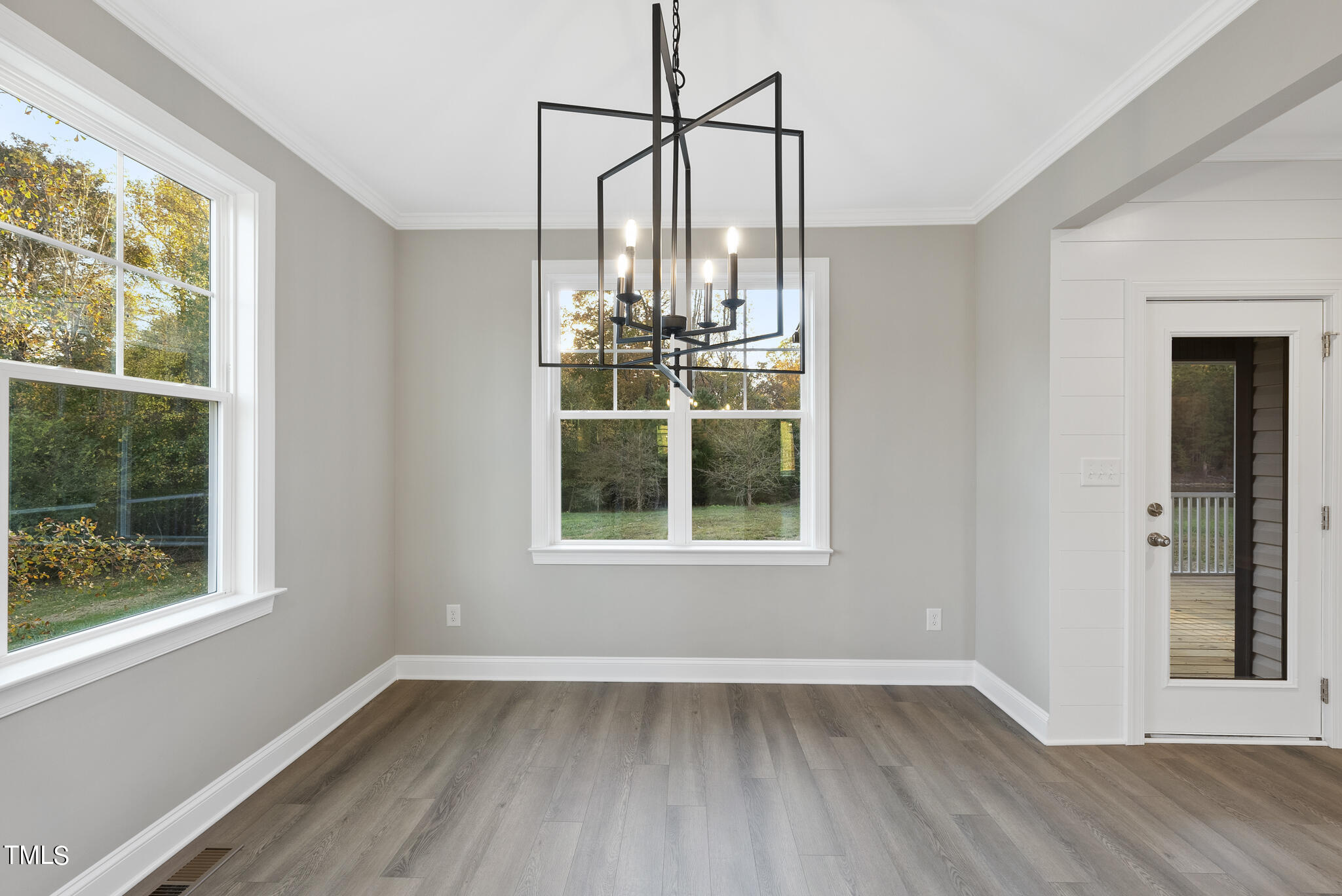 70 Pilot Ridge Road Zebulon, NC 27597 - Photo 14 of 37 a view of an empty room with wooden floor and a window