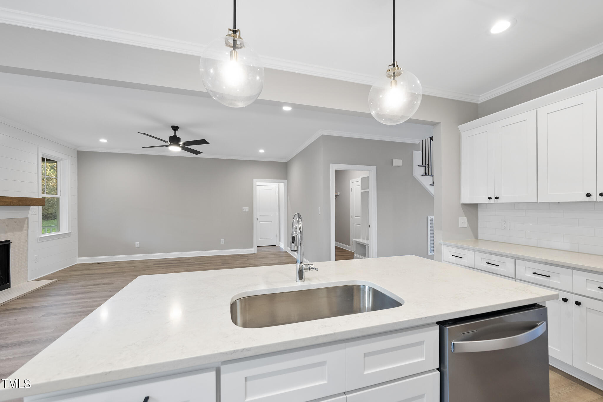 70 Pilot Ridge Road Zebulon, NC 27597 - Photo 16 of 37 a kitchen with a sink a counter space and wooden floor