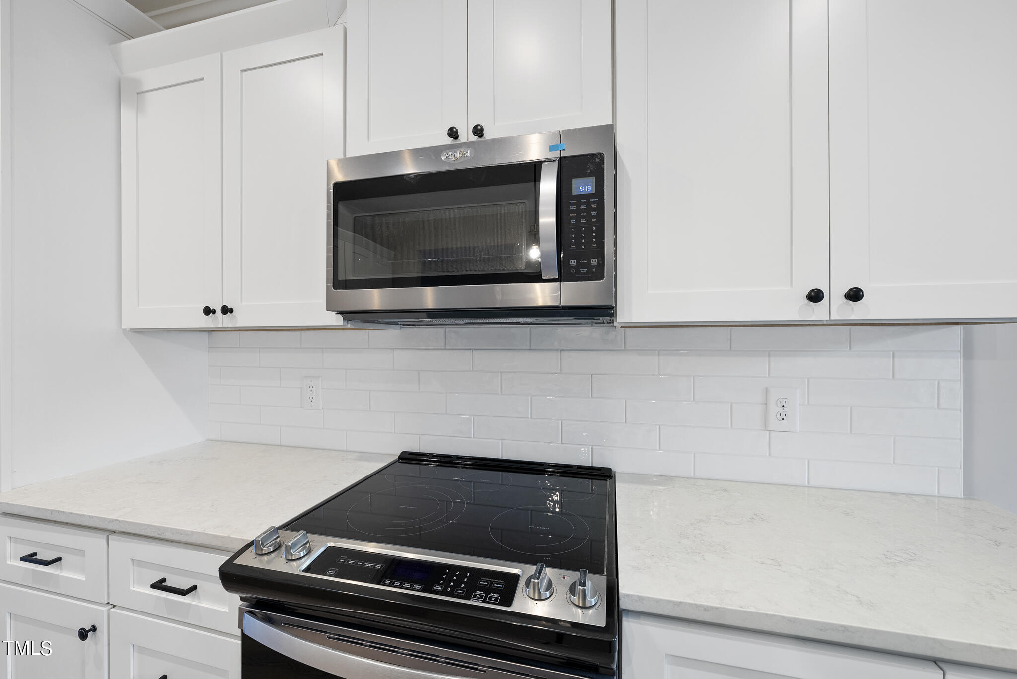 70 Pilot Ridge Road Zebulon, NC 27597 - Photo 17 of 37 a kitchen with a stove and a microwave
