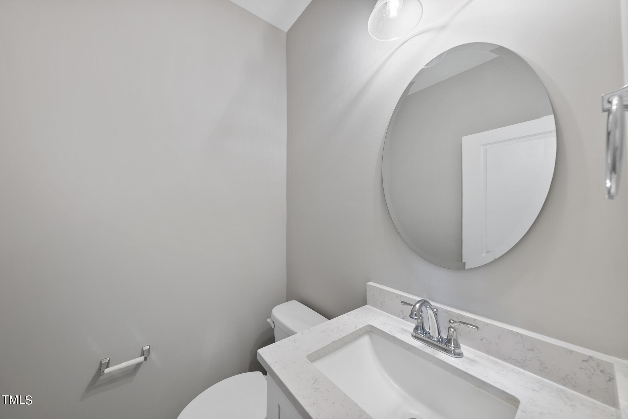 70 Pilot Ridge Road Zebulon, NC 27597 - Photo 18 of 37 a bathroom with a sink mirror and toilet