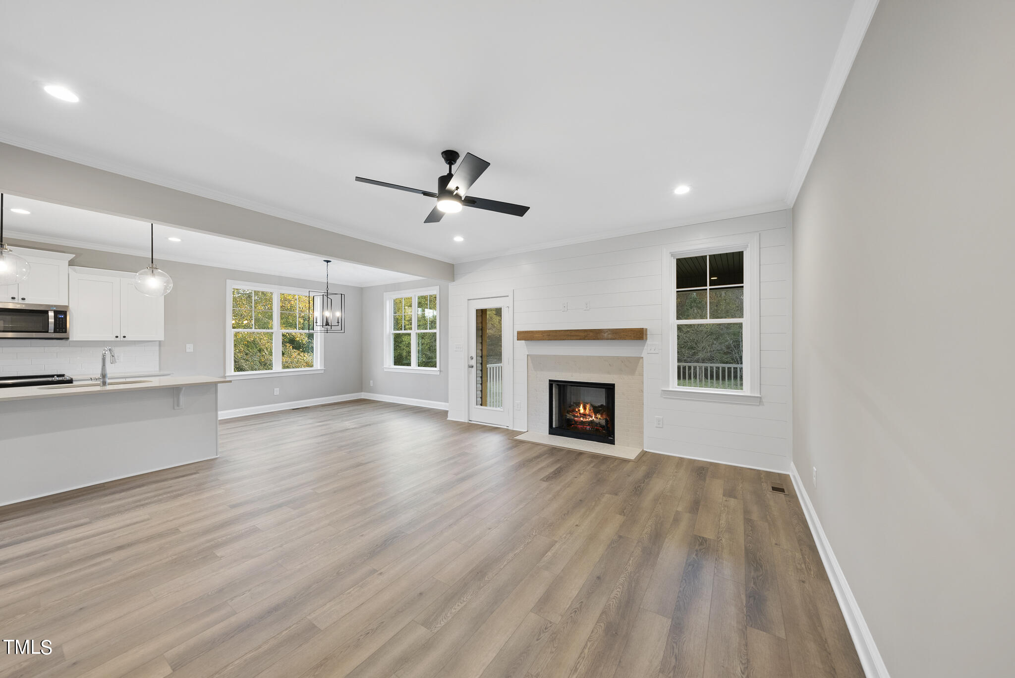 70 Pilot Ridge Road Zebulon, NC 27597 - Photo 20 of 37 a view of empty room with wooden floor and fireplace