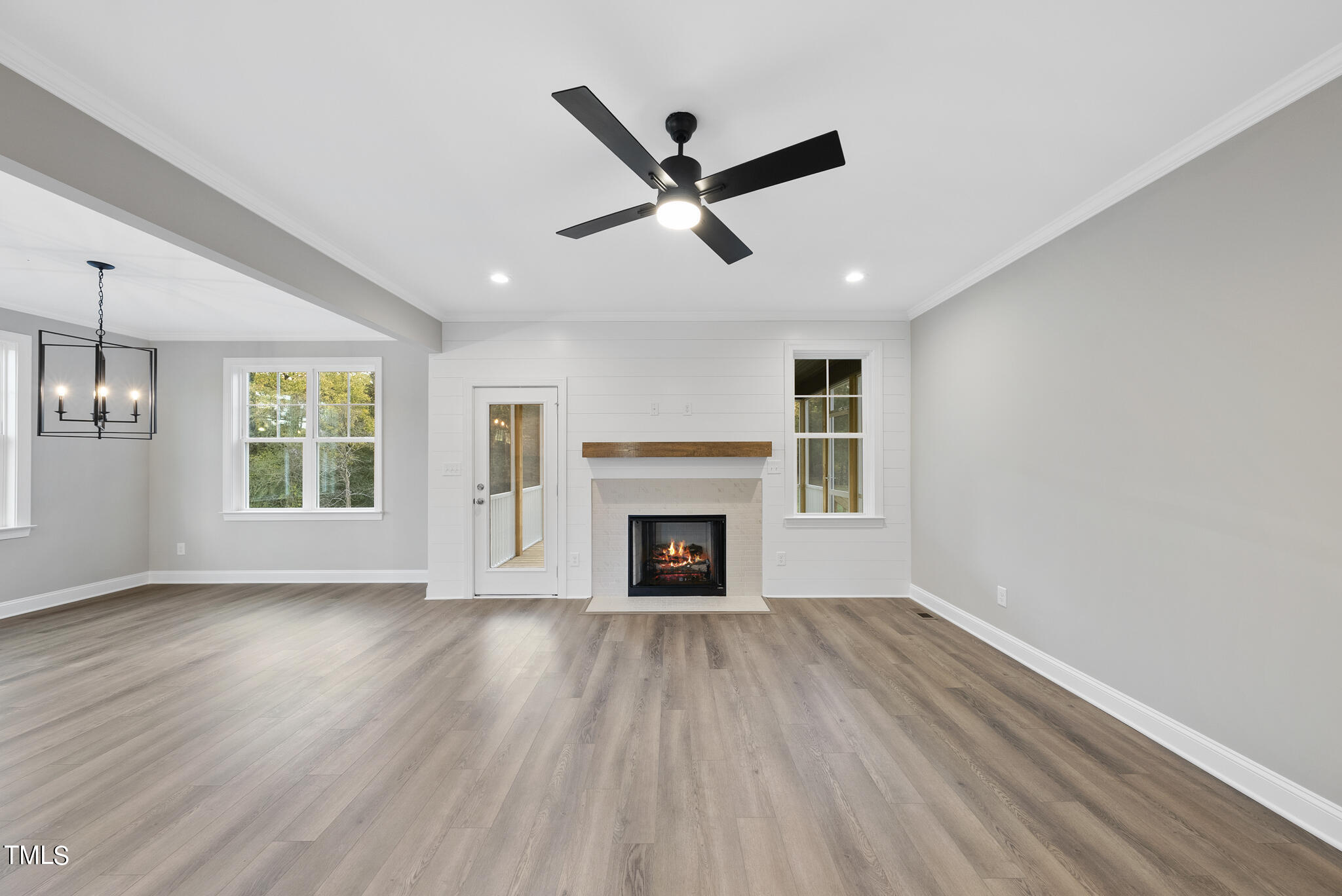 70 Pilot Ridge Road Zebulon, NC 27597 - Photo 21 of 37 a view of wooden floor fire place refrigerator and window in a room