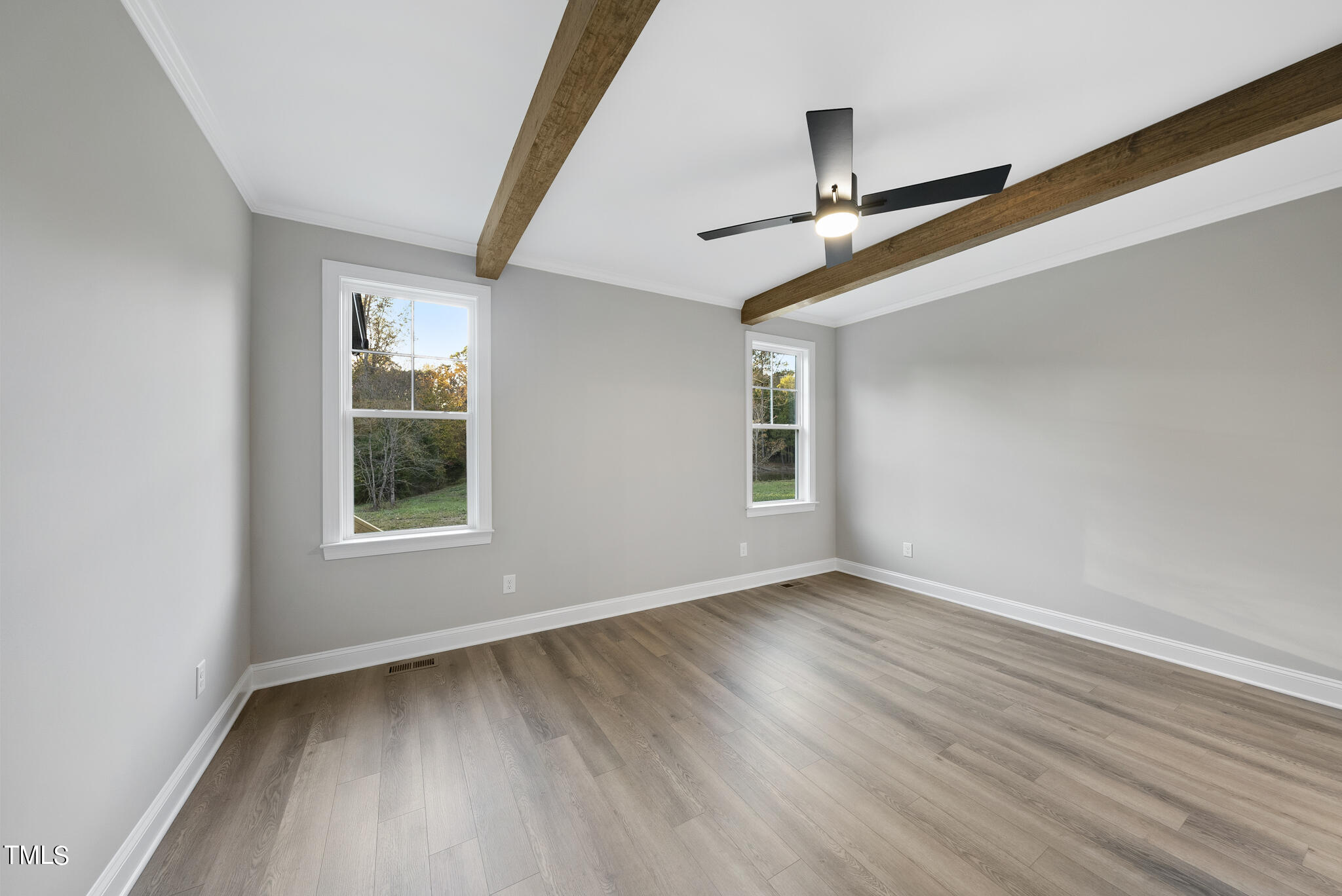 70 Pilot Ridge Road Zebulon, NC 27597 - Photo 23 of 37 a view of an empty room with wooden floor and a window