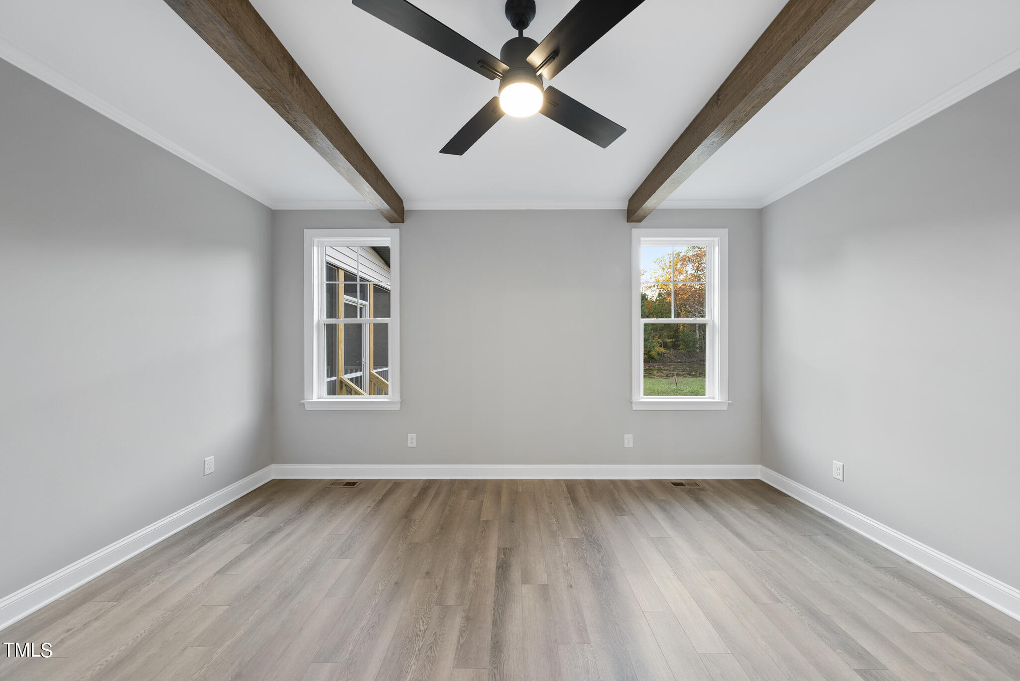 70 Pilot Ridge Road Zebulon, NC 27597 - Photo 24 of 37 an empty room with wooden floor ceiling fan and windows