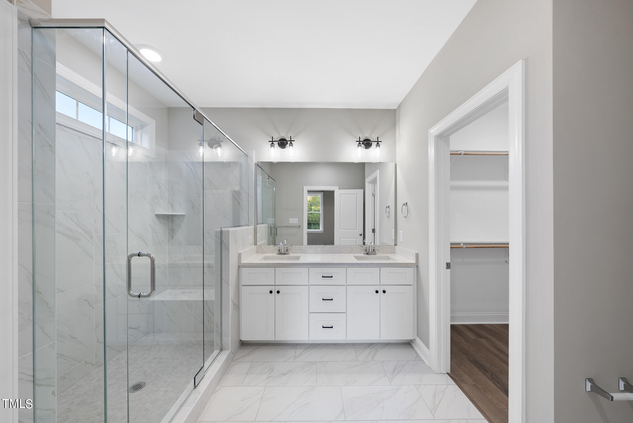 70 Pilot Ridge Road Zebulon, NC 27597 - Photo 25 of 37 a bathroom with a double vanity sink mirror and shower