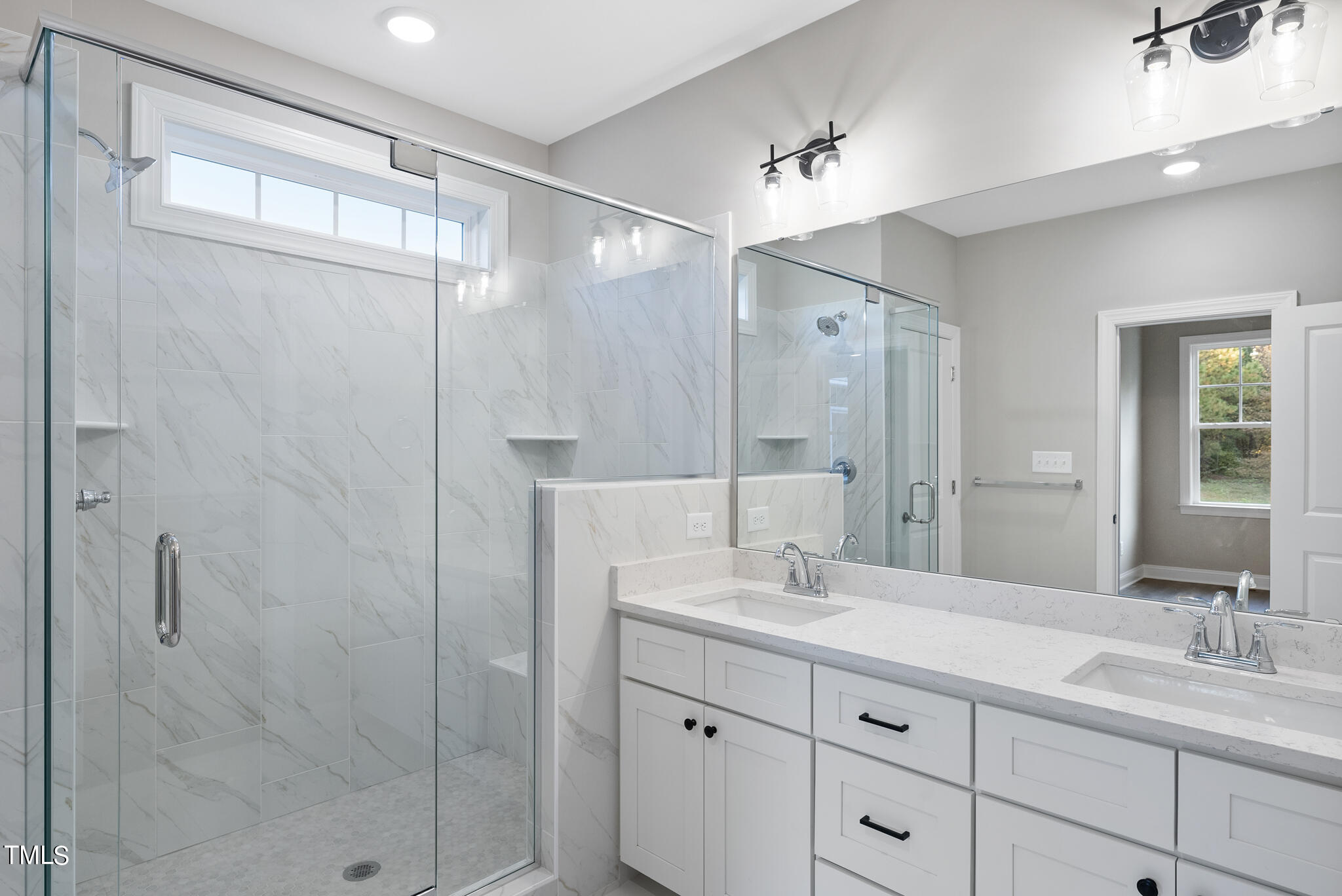 70 Pilot Ridge Road Zebulon, NC 27597 - Photo 26 of 37 a bathroom with a double vanity sink mirror and shower