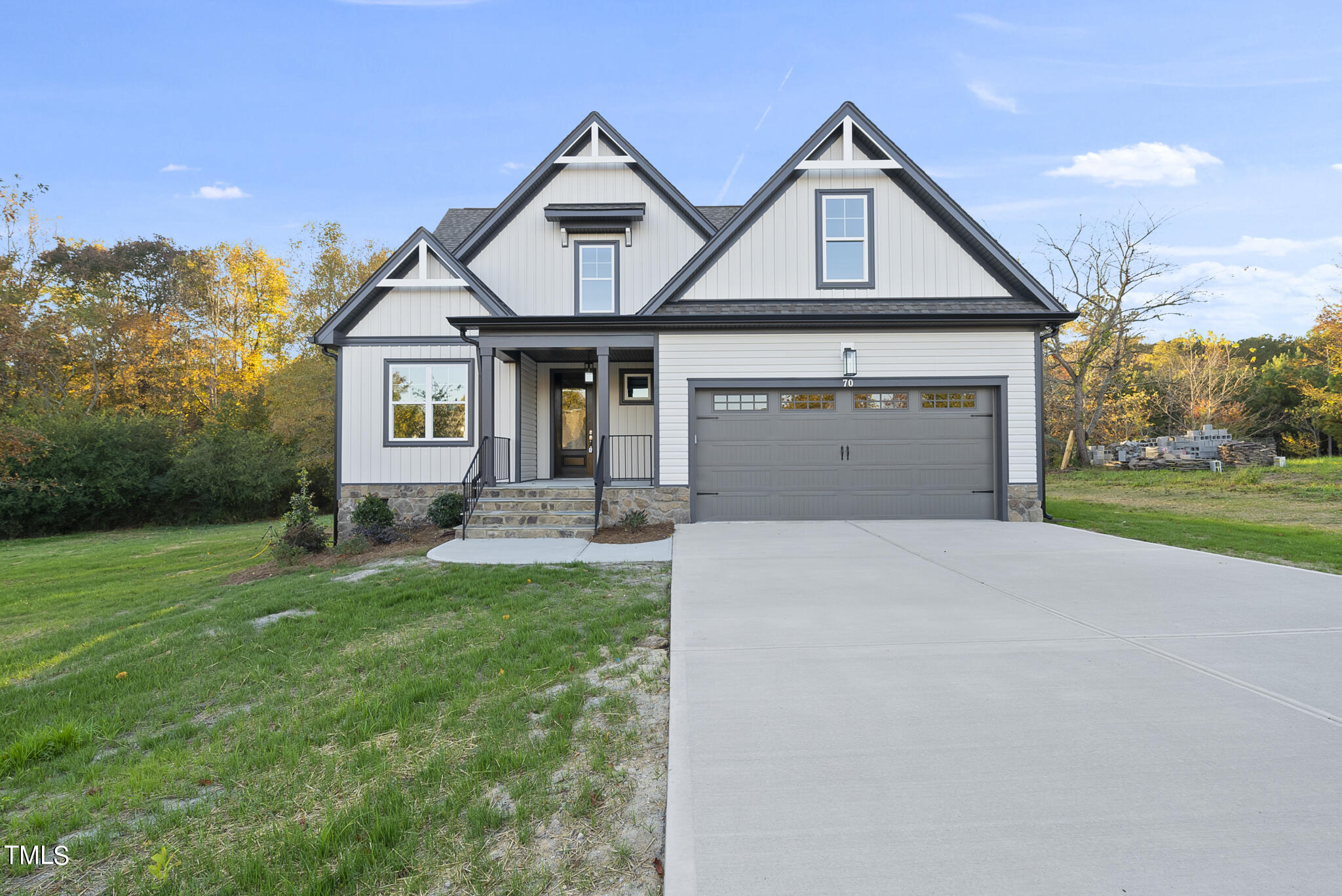 70 Pilot Ridge Road Zebulon, NC 27597 - Photo 3 of 37 a front view of a house with a yard and garage