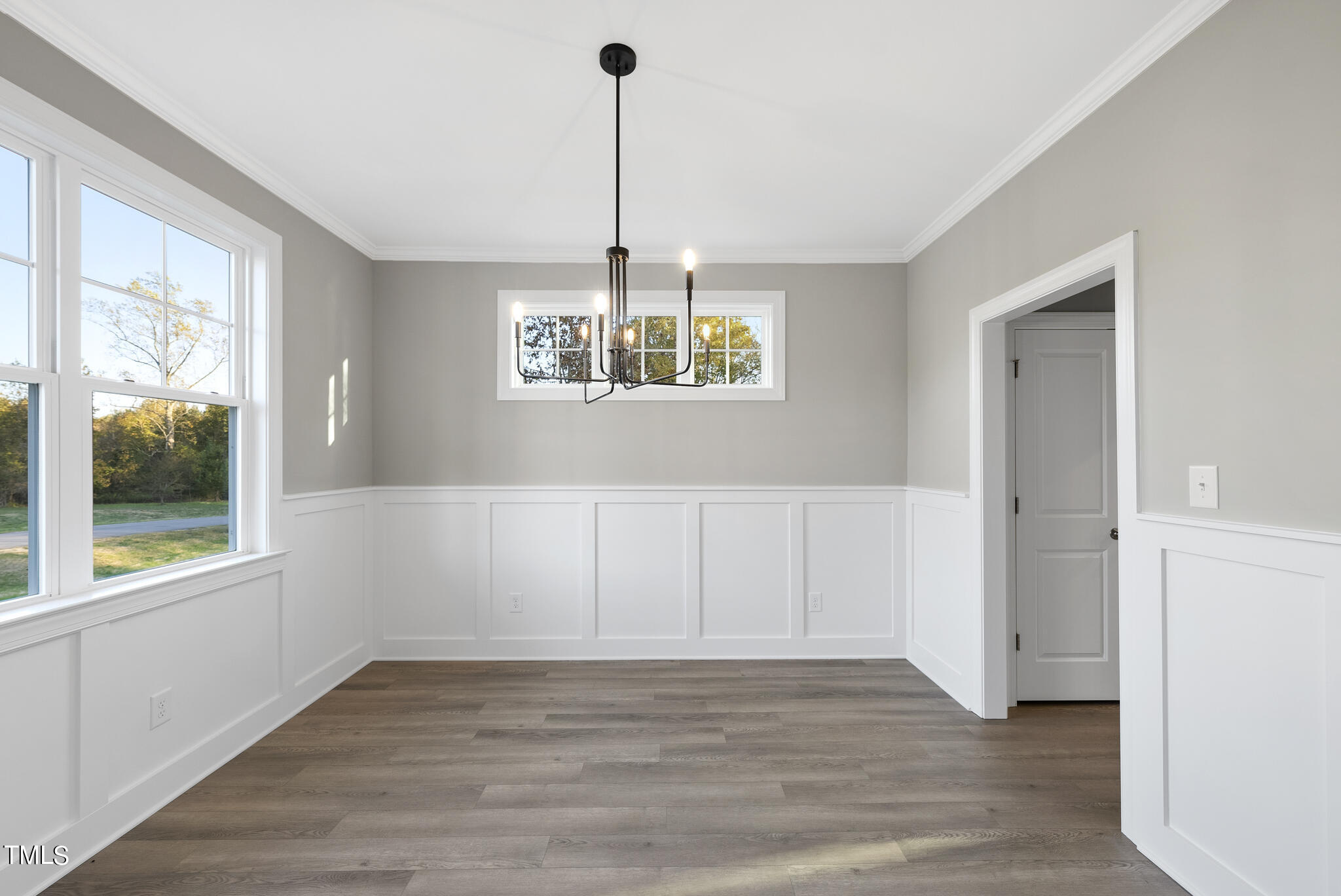 70 Pilot Ridge Road Zebulon, NC 27597 - Photo 8 of 37 a view of an empty room with wooden floor and a window