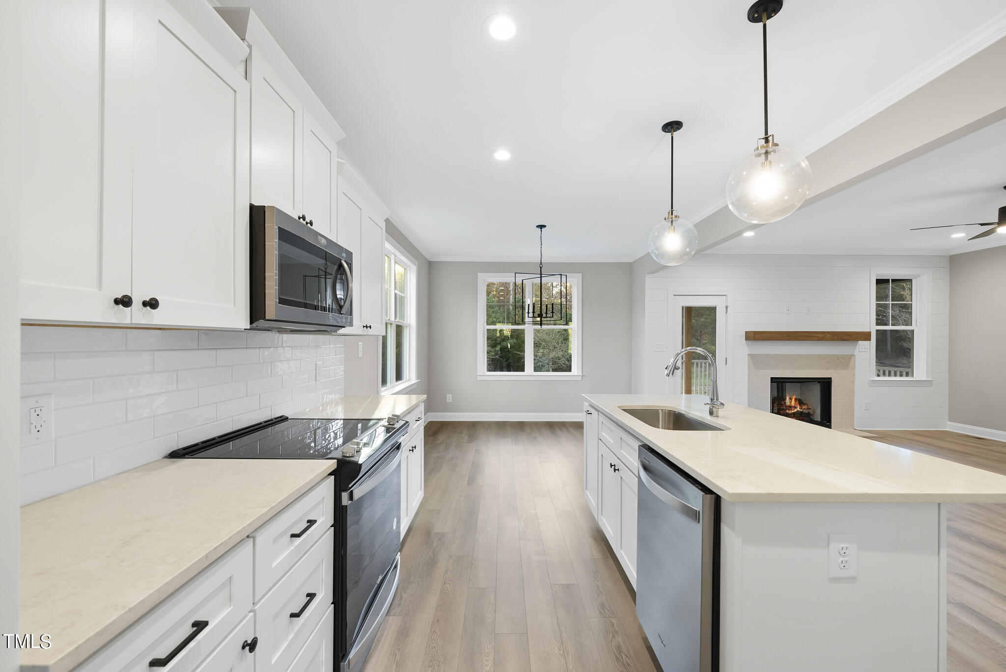 70 Pilot Ridge Road Zebulon, NC 27597 - Photo 10 of 37 a kitchen with a sink stove and microwave