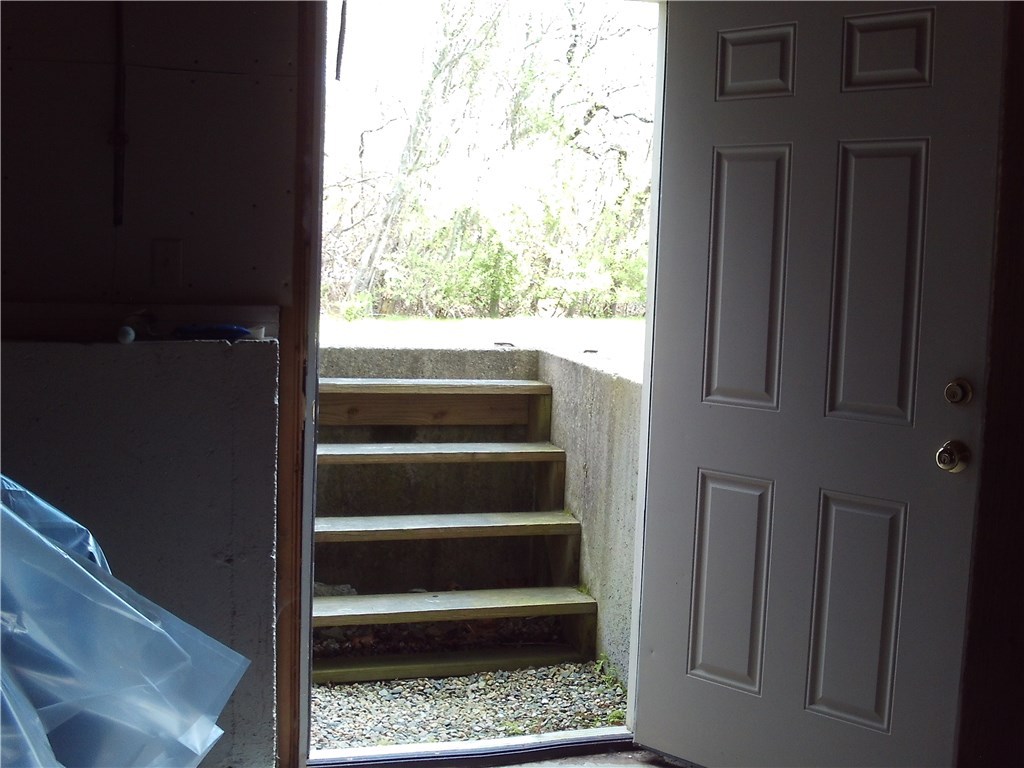 660 Point Judith Road, Unit B 3 Narragansett, RI 02882 - Photo 13 of 19 Walkout from unfinished basement to back yard.