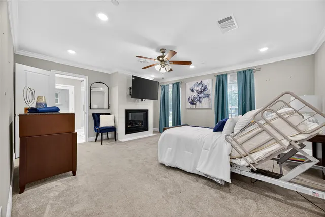 a spacious bedroom with a bed and a fireplace