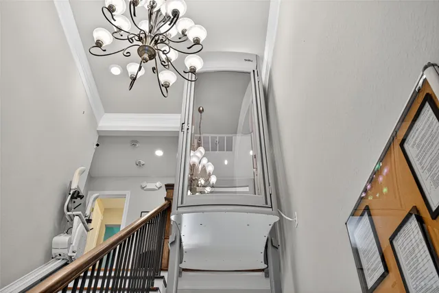 a view of a livingroom with furniture and staircase