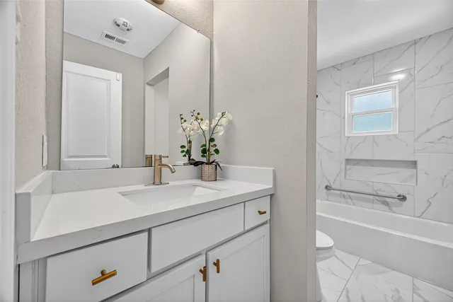 a bathroom with a sink and a bathtub