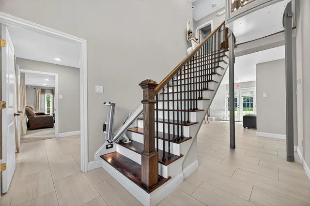 a view of a hallway with seating area