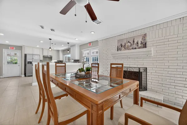 a dining room with furniture and window