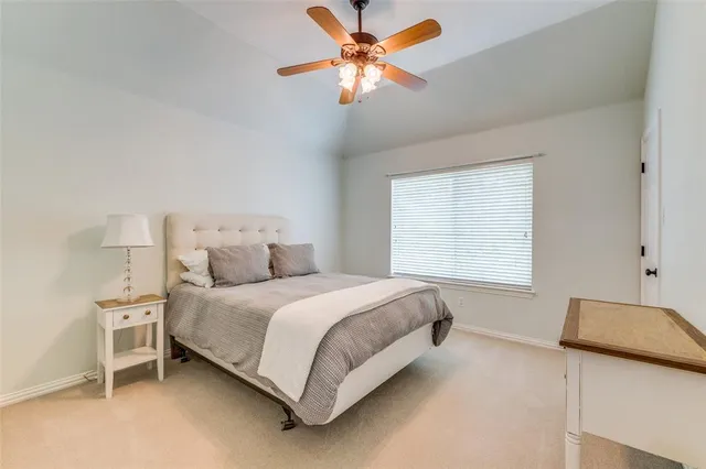 a bed room with a bed and a chandelier