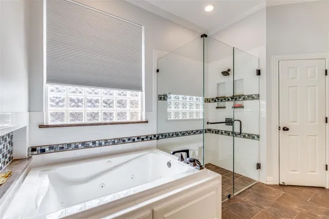 a bathroom with a bathtub and a sink